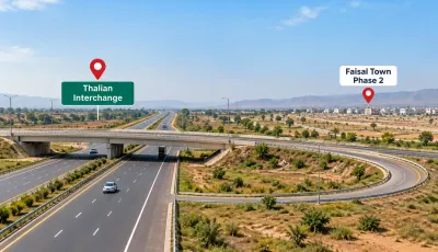 Thalian Interchange motorway connection near Faisal Town Phase 2 Islamabad with divided roads and surrounding residential development.