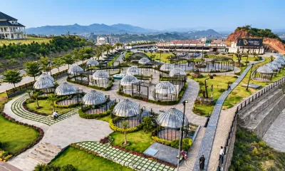 Park View City Islamabad landscaped recreational area with dome-shaped gazebos, gardens, walkways, and surrounding hills.