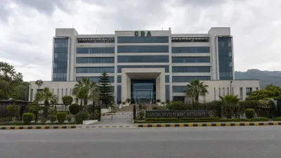 An authoritative and clean architectural photograph of the Capital Development Authority (CDA) Headquarters building in Islamabad, a multi-story modern government structure with glass windows and manicured landscaping.
