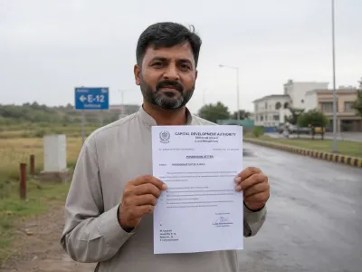Allottee holding CDA possession letter for a plot in E-12 Islamabad