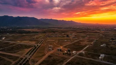 Aerial view of Sector E-12 Islamabad with partially developed land and Margalla Hills