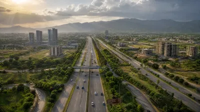 Wide-angle documentary photograph of the Islamabad Expressway and developing residential corridors in Zone-5.
