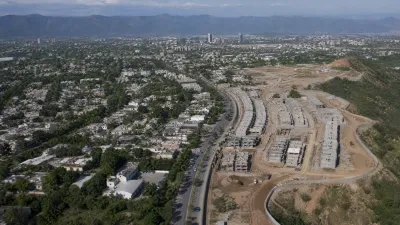 Aerial drone shot of Zone-5 Islamabad showing the contrast between developed sectors and new housing construction sites.