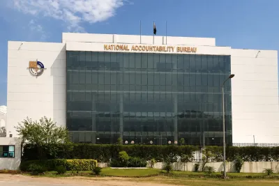 "Government institutional building representing anti-corruption inquiry"