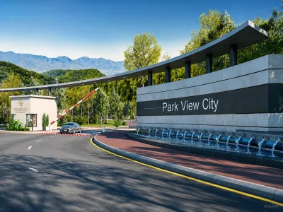 Park View City Islamabad entrance featuring the main gate, landscaped surroundings, water fountains and Margalla Hills in the background.