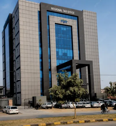 FBR Regional Tax Office building in Pakistan with parked vehicles and the official FBR signage.