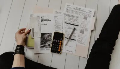 Property documents and a site plan being reviewed during resale due diligence.