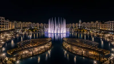 Dancing fountains and man-made lake at Downtown Park View City Islamabad lit up at night
