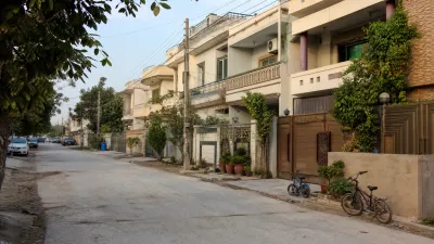 A residential housing scene illustrating the comparison between Gulshan Abad and Media Town in Rawalpindi, highlighting differences in development, property sizes and family-oriented demand.
