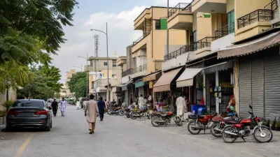 Commercial market street inside a residential housing society in Islamabad.