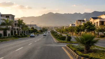 Mature landscaped boulevard and residential homes representing established neighbourhood development.
