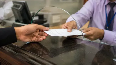 Paying withholding tax as part of an Islamabad property transfer at a bank counter