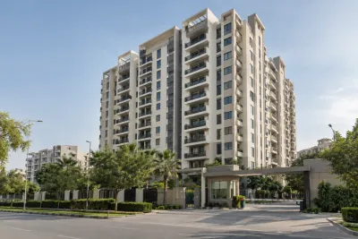 Residential apartment tower in G-11/3 Islamabad with balconies and a gated entrance