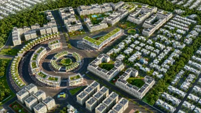 Aerial view of a master-planned residential and commercial development with villas, apartment blocks, landscaped areas, roads, and a central circular commercial district.